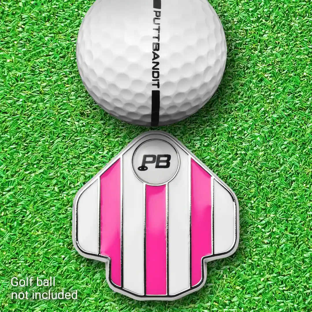 PuttBANDIT LP pink golf ball marker top view with golf ball on grass, ball not included text